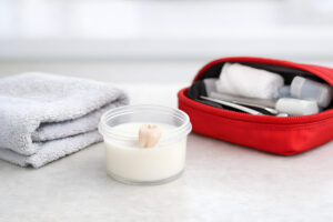 Knocked-Out Tooth Emergency Care Concept, Non-Graphic, Tooth in Milk