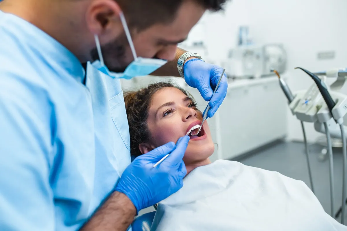 Dental patient smiling during a checkup at Spring St. Dental