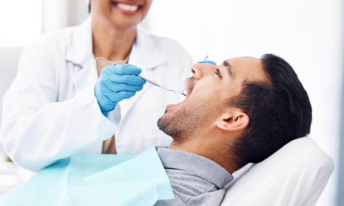 Patient, tooth or open mouth in oral cleaning with mirror, excavator or orthodontics surgery